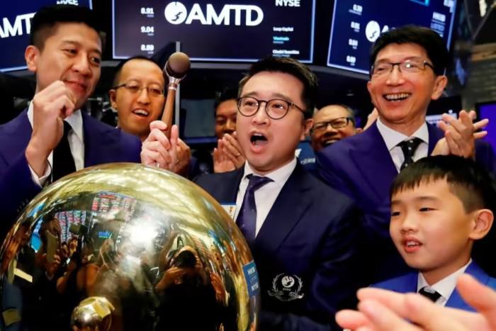 AMTD Digital founder Calvin Choi rings a ceremonial bell on the floor of the New York Stock Exchange