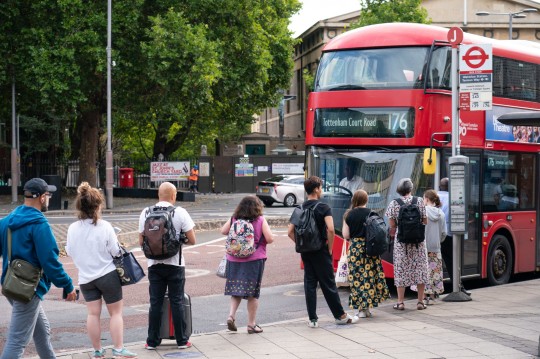 People queue for a bus outside Waterloo station, in central London. Tube, rail and bus services are set to be severely disrupted in the capital as members of Unite and the Rail, Maritime and Transport (RMT) union strike in a continuing row over pay, jobs and conditions. Picture date: Friday August 19, 2022. PA Photo. See PA story INDUSTRY Tube. Photo credit should read: Dominic Lipinski/PA Wire