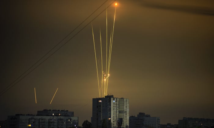 Russian rockets launched from the Belgorod region are seen at dawn in Kharkiv, Ukraine, on Saturday.