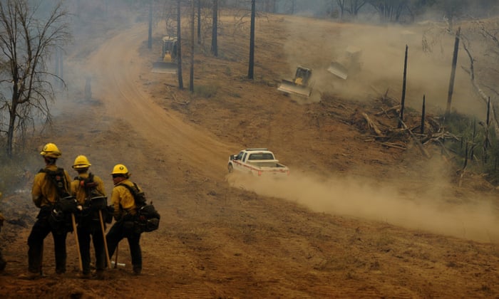 Firefighters conducting controlled burns along the bulldozer lines on the Oak Fire near Jerseydale, California, on July 26.