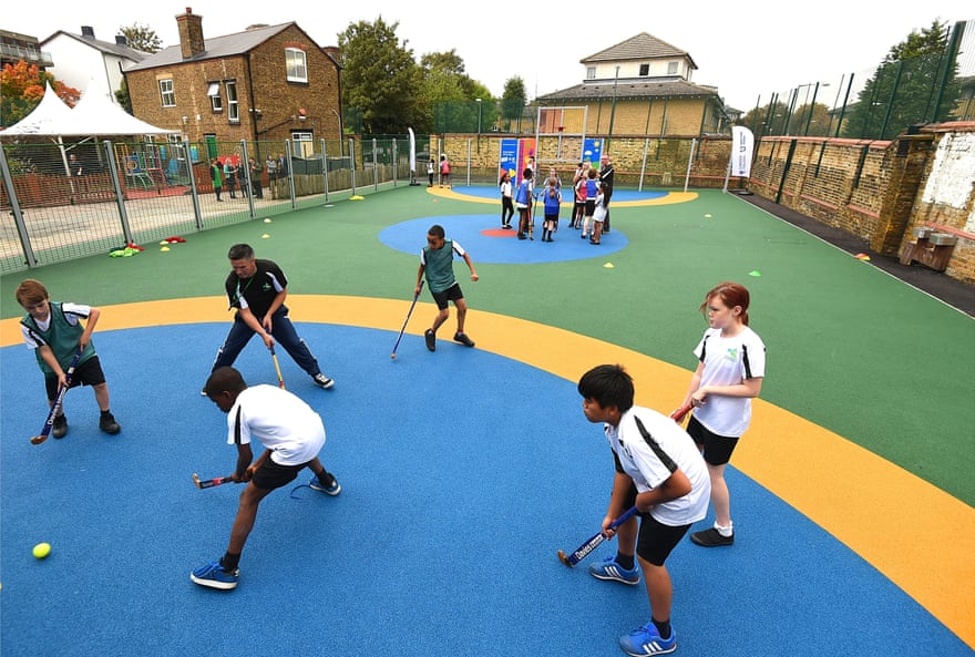 Woodhill Primary School pupils play hockey as they celebrate the opening of its new multi-use sports facility in October 2014. The Greenwhich school, the first in London to be completed, received £30,000 of National Lottery funding from Sport England’s Primary Spaces fund to transform its playground.