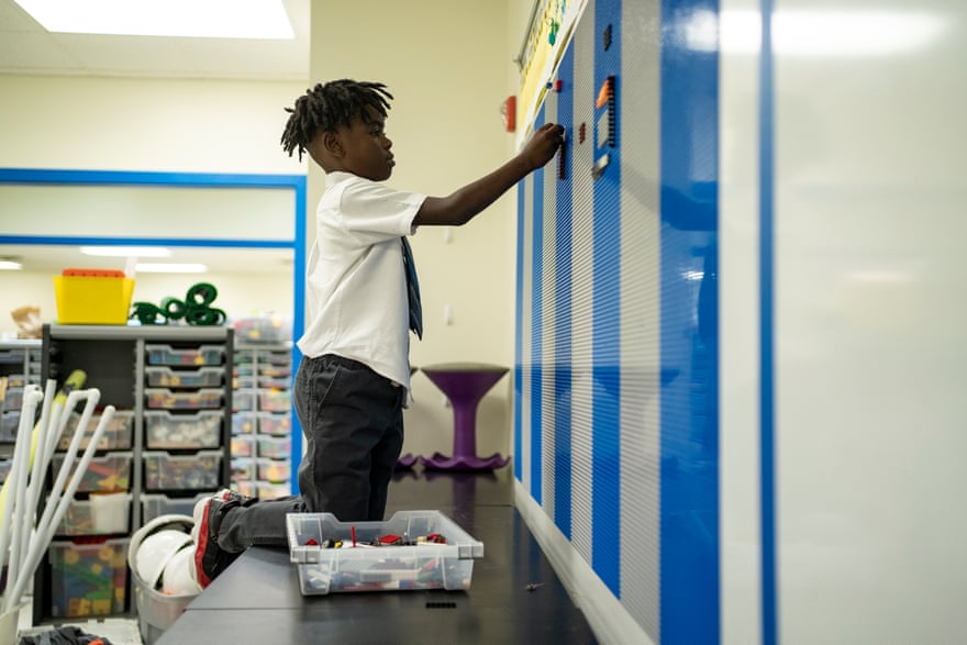 Wesley interacts with the leggo wall at Solar Prep School for Boys.