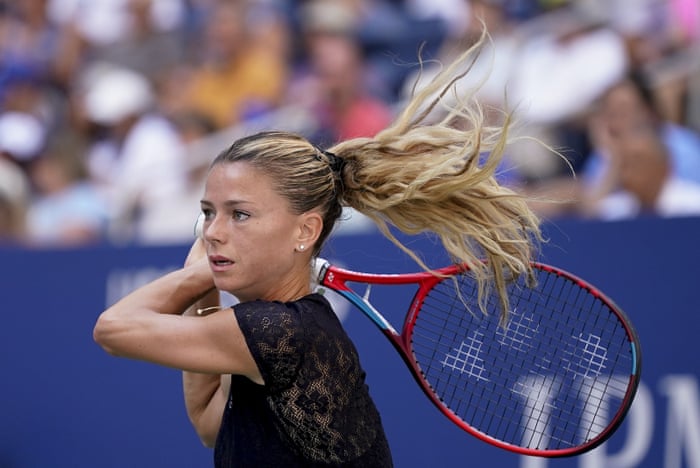 Camila Giorgi returns a shot to Madison Keys.